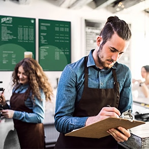 barista with clipboard